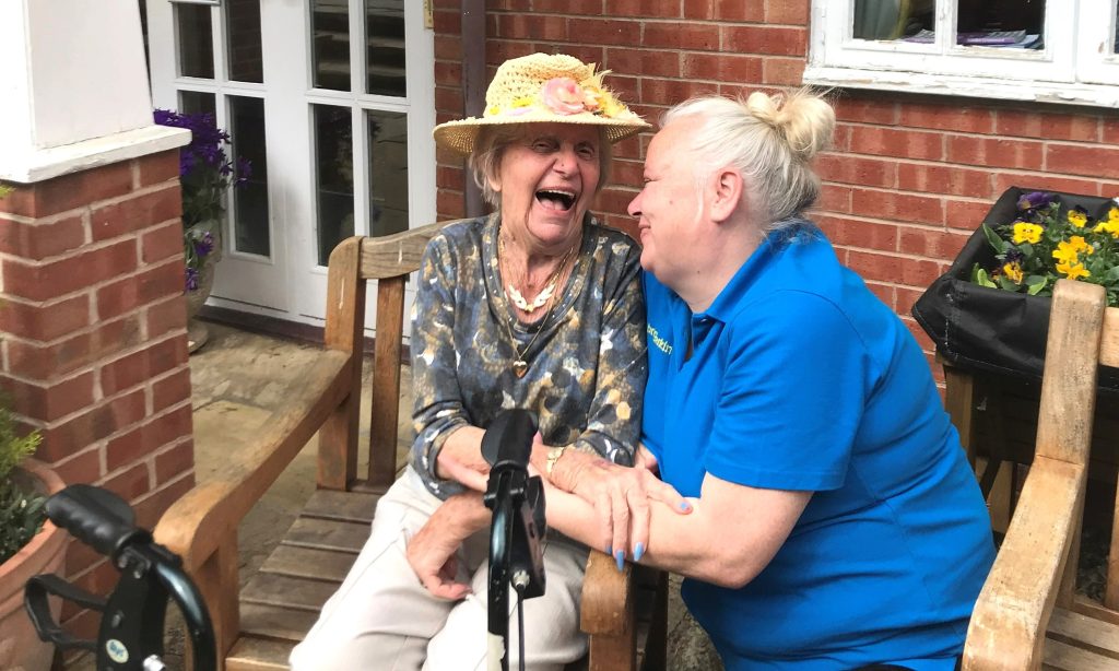 Resident and carer laughing at the Lawns Care Home