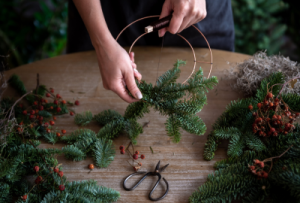 Making a Christmas wreath - adding the foliage