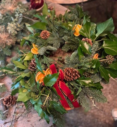 Christmas Wreath ideas with dried orange and pine cones and orange velvet ribbon